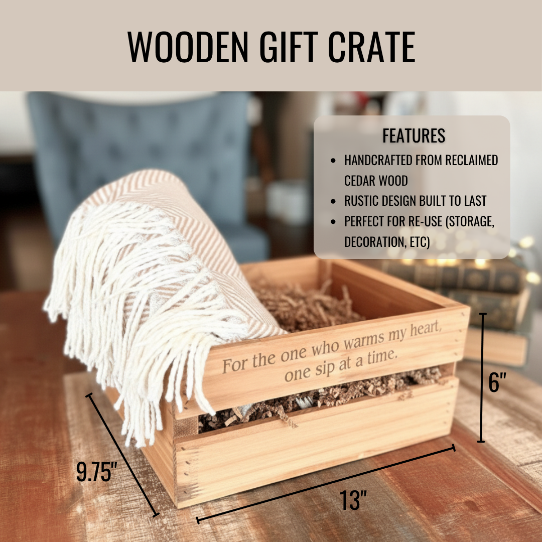 Wooden cedar crate with sample engraving reading "For the one who warms my heart, one sip at a time," displayed with cream tassel throw blanket and tea sachets, measuring 13 inches wide by 9.75 inches deep by 6 inches tall.