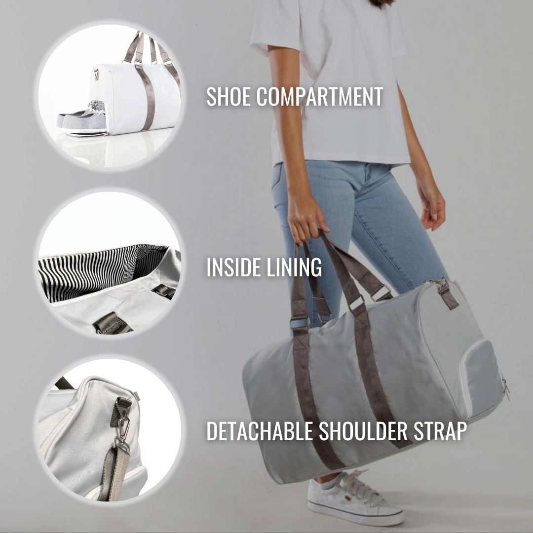 White canvas duffle bag worn over shoulder, showing shoe compartment, striped inside lining, and detachable grey shoulder strap with hardware details