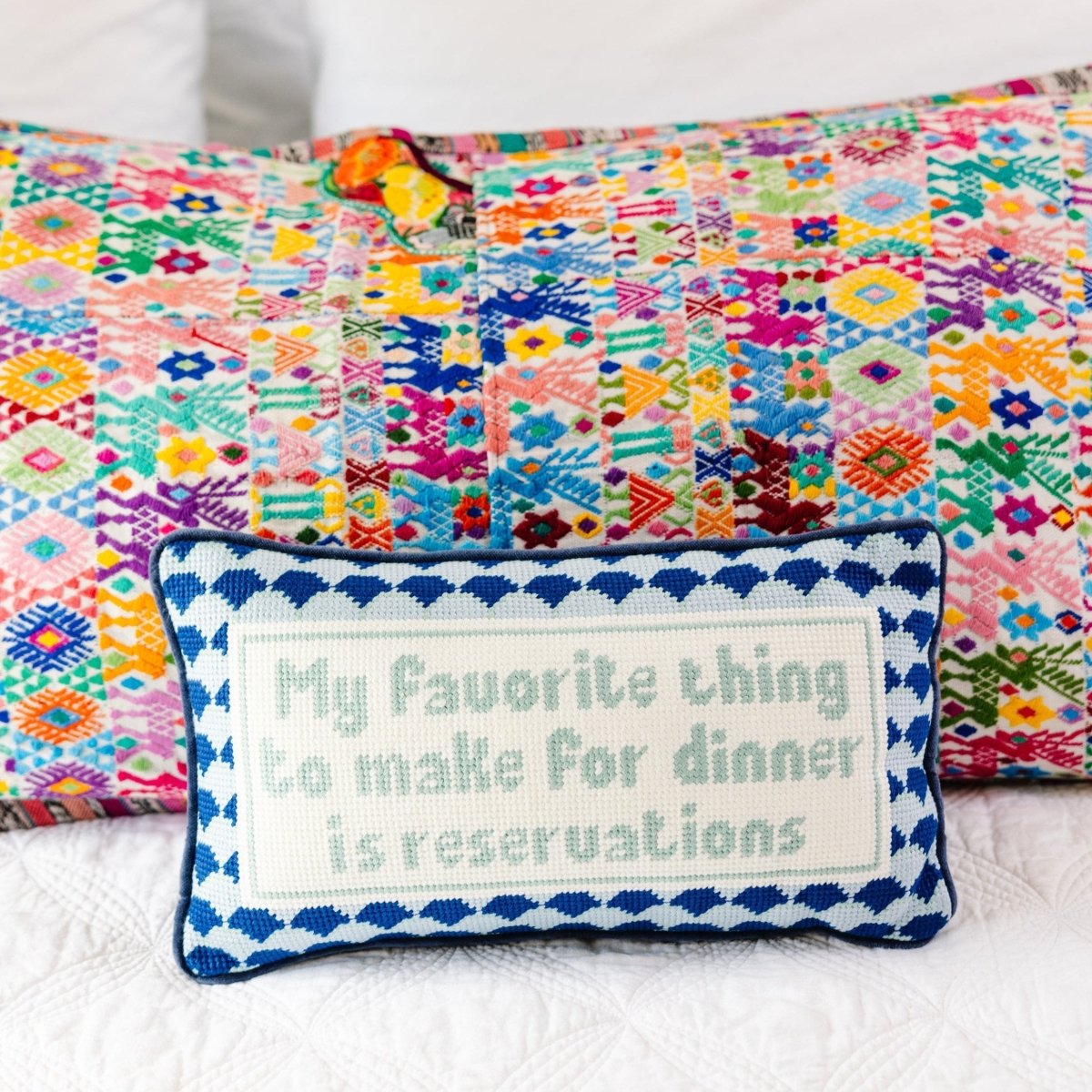 Reservations needlepoint pillow with 100% wool front and cotton velvet back, 8x14 inches, ideal for humor-filled, stylish decor.