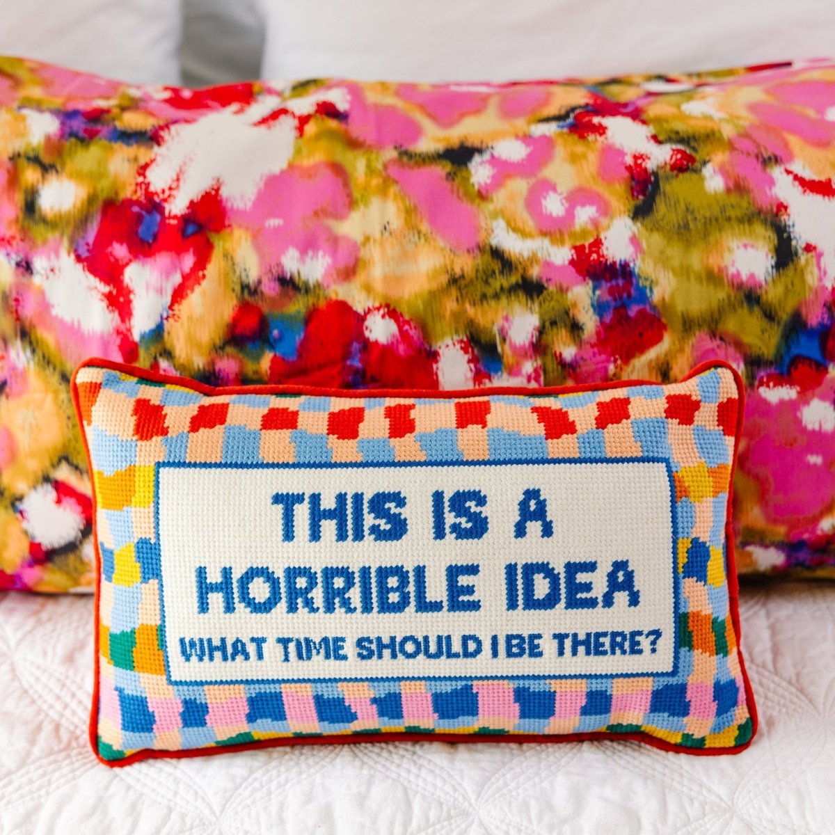 Horrible Idea needlepoint pillow with bold 100% wool embroidery and cotton velvet backing, measuring 9x15 inches, for a playful touch to your decor.
