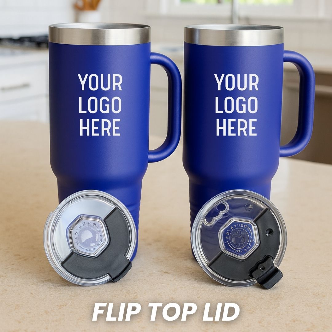 Pair of royal blue 40 oz. tumblers with stainless steel rim and flip-top lids, showing customization area on barrel with placeholder text "YOUR LOGO HERE