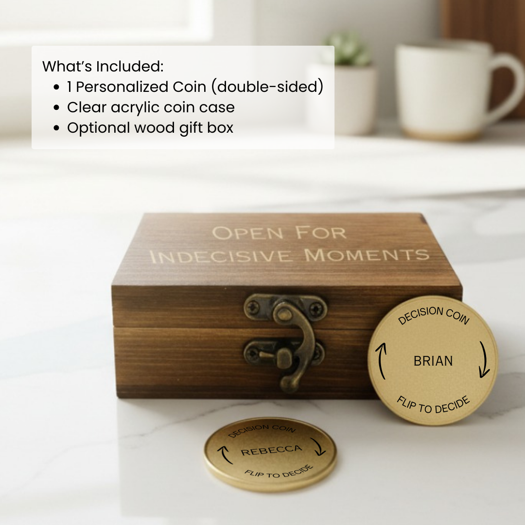Personalized brass decision coins with sample names "Brian" and "Rebecca" engraved on each side, displayed with wooden gift box reading "Open for Indecisive Moments