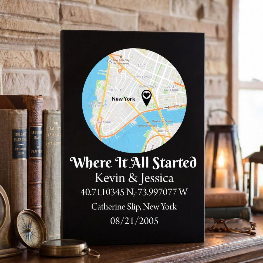 Black leatherette sign with circular New York map featuring heart marker, engraved with sample names Kevin & Jessica, coordinates, location Catherine Slip, and date 08/21/2005