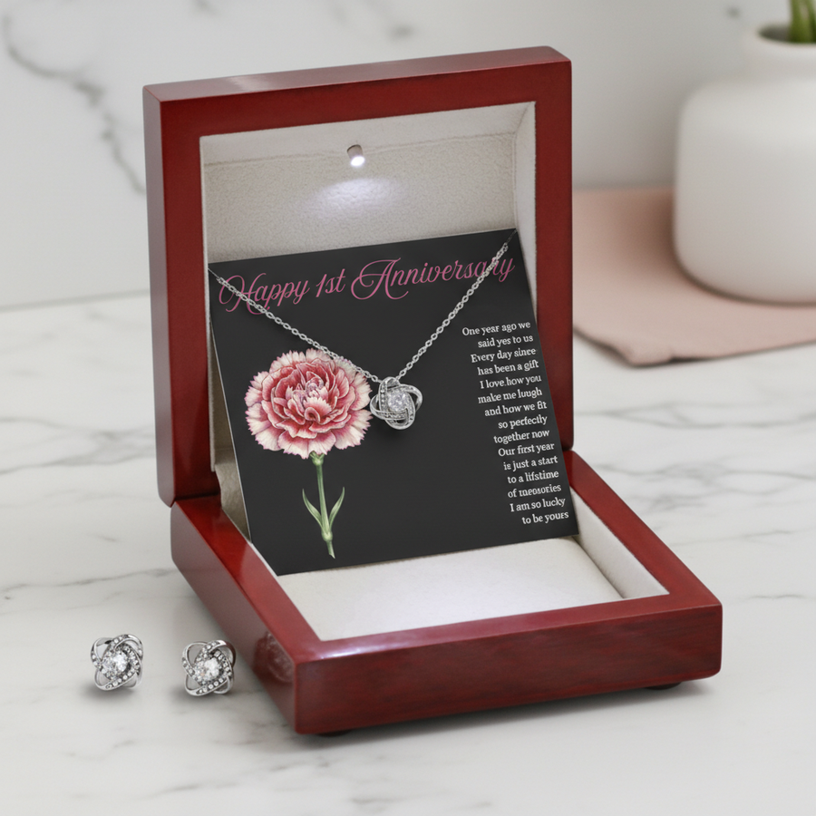Jewelry set with necklace and earrings in a wooden box on a marble surface