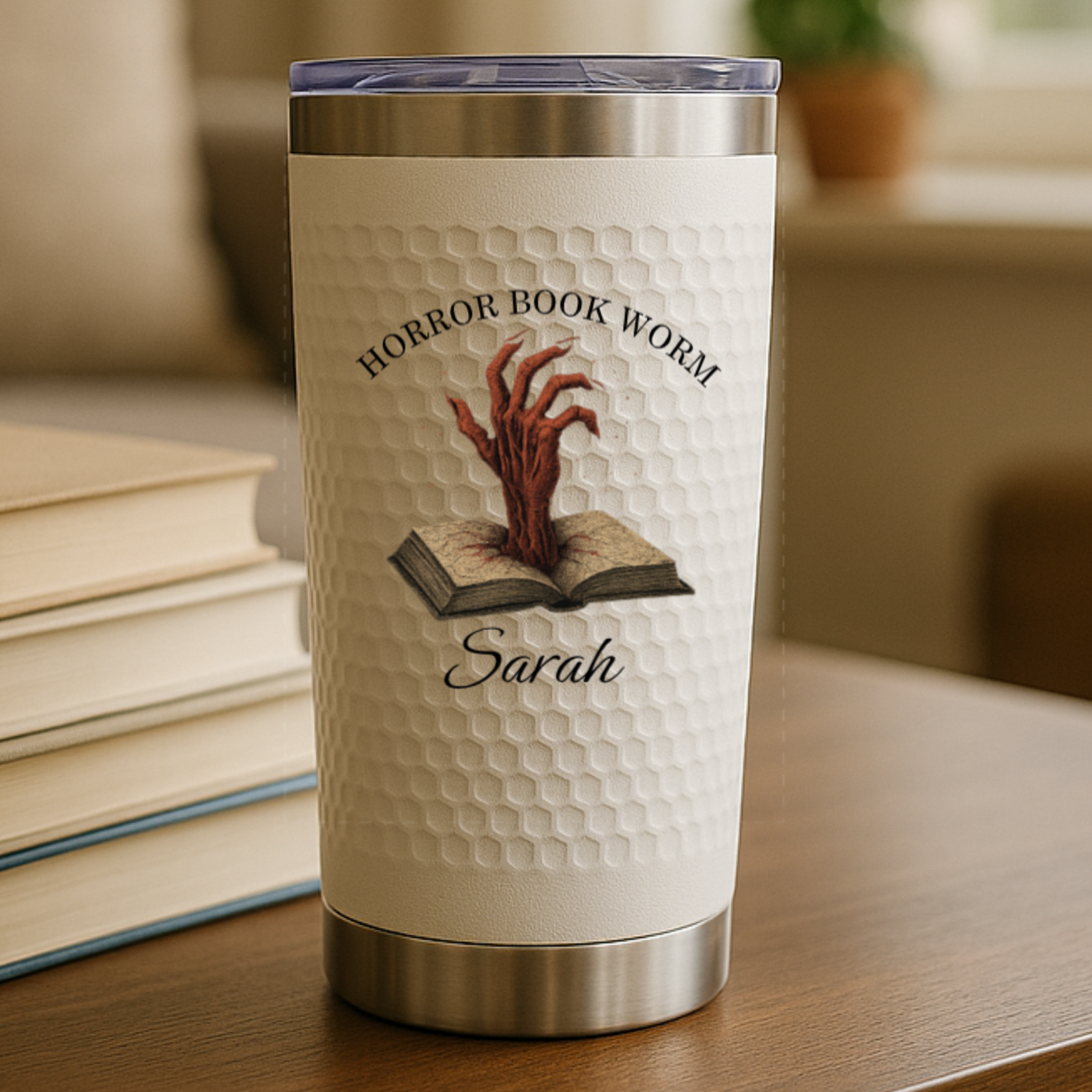 Custom book-themed tumbler with floral and fantasy designs personalized with name
