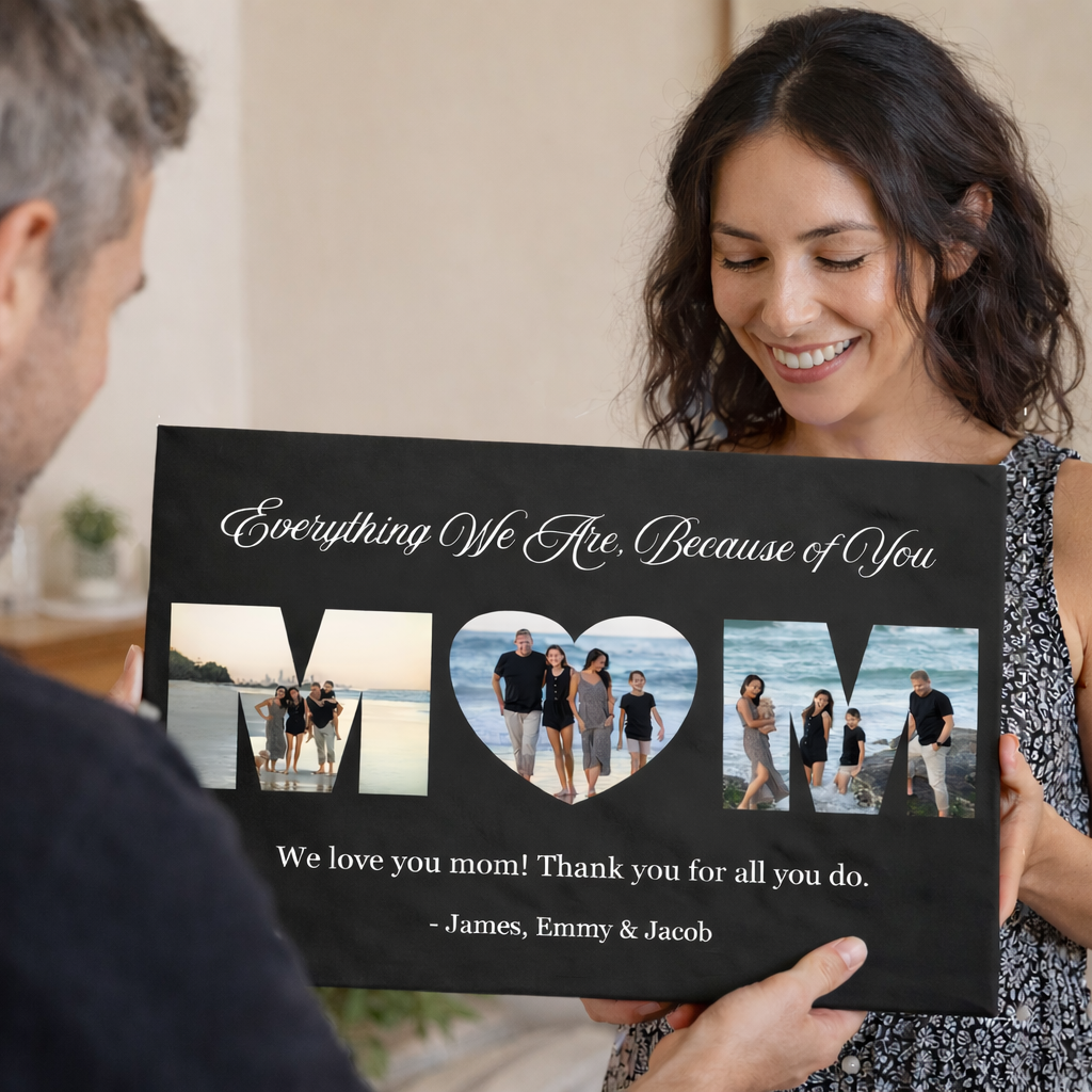 Black leatherette wall sign held by woman, featuring three photo cutouts spelling "MOM" with sample family beach photos, script text "Everything We Are, Because of You," and personalized message "We love you mom! Thank you for all you do. -James, Emmy & Jacob