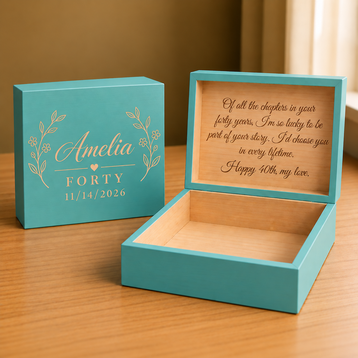 Teal keepsake box with sample engraving showing name, age, and birthday date on lid and personalized message inside with gold foil details