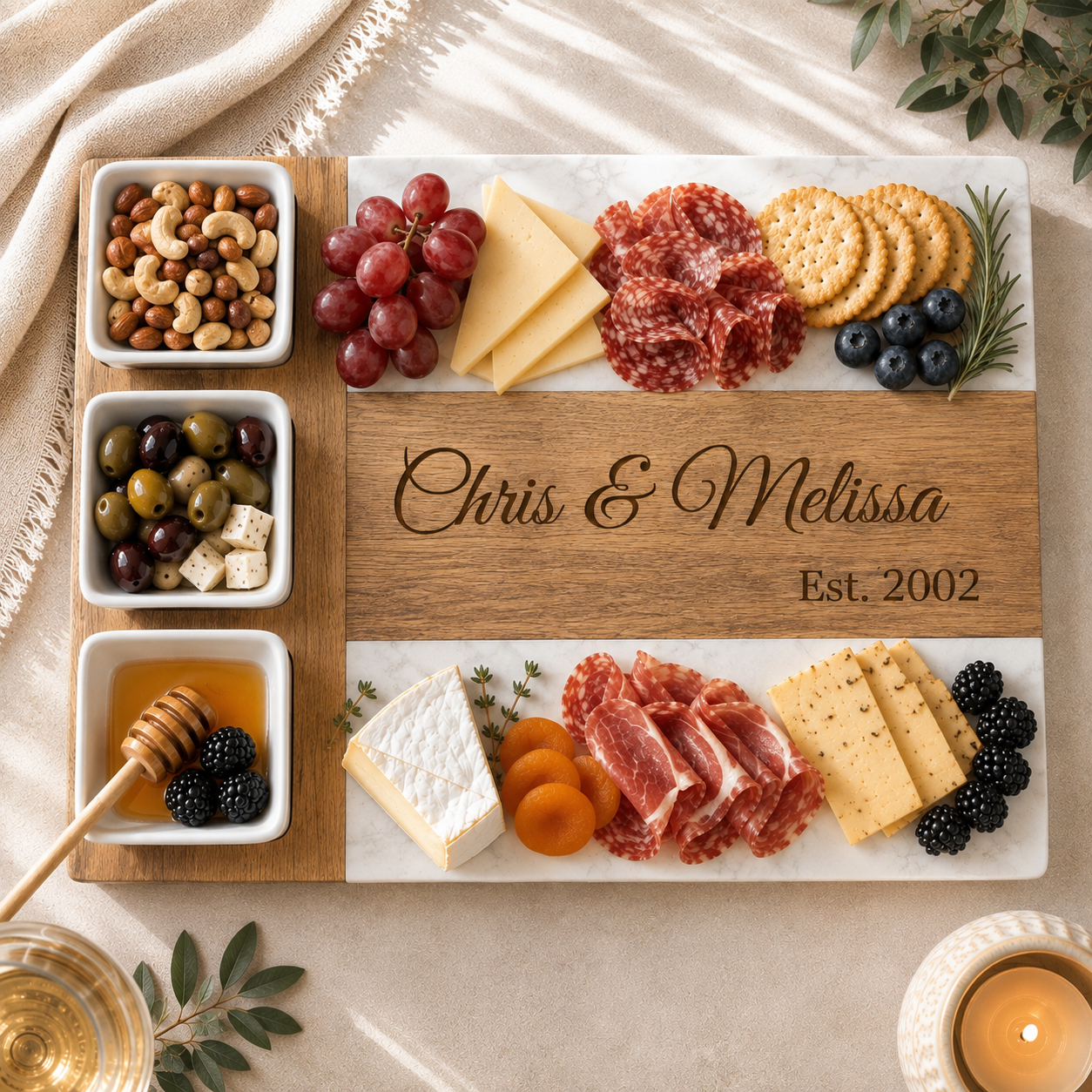 Personalized anniversary charcuterie board engraved with a couple's names, arranged with salami, cheese, crackers, blackberries, apricots, olives, nuts, and honey for entertaining.