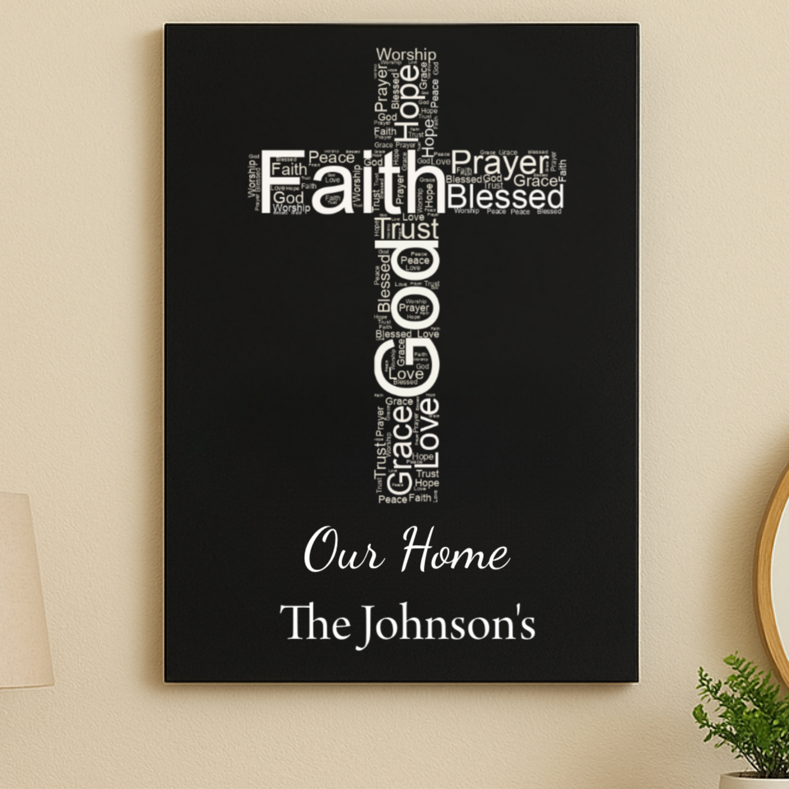 Black wall sign with cross-shaped word art featuring faith-themed words, customized with sample text "Our Home" and "The Johnson's" at bottom
