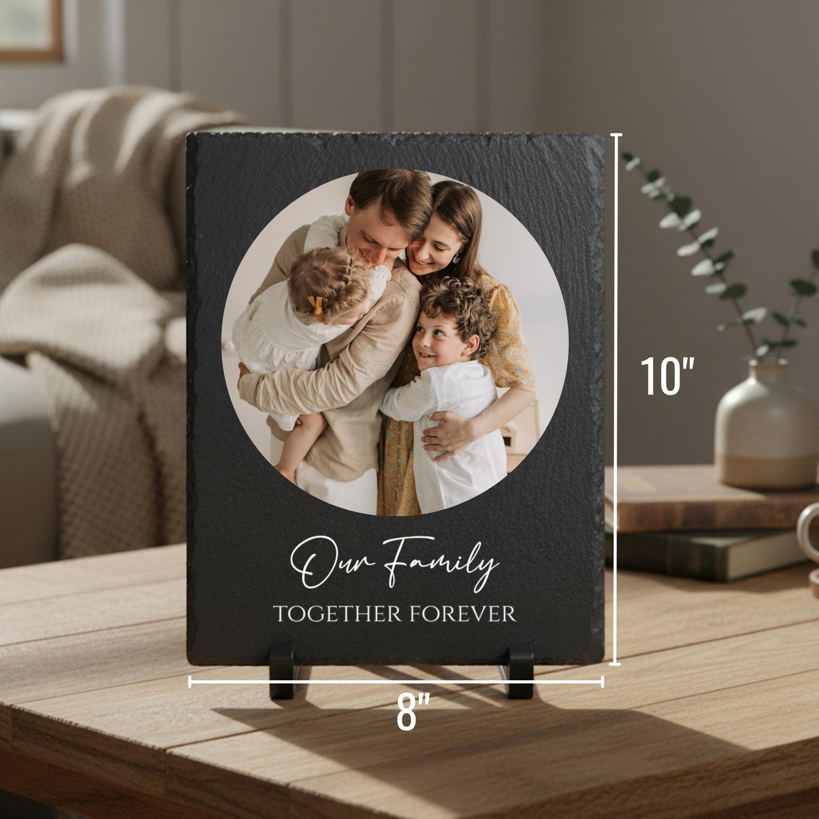 Black slate plaque, 8" wide by 10" tall, displaying circular family photo with "Our family TOGETHER FOREVER" engraved below, shown on wooden surface with stand