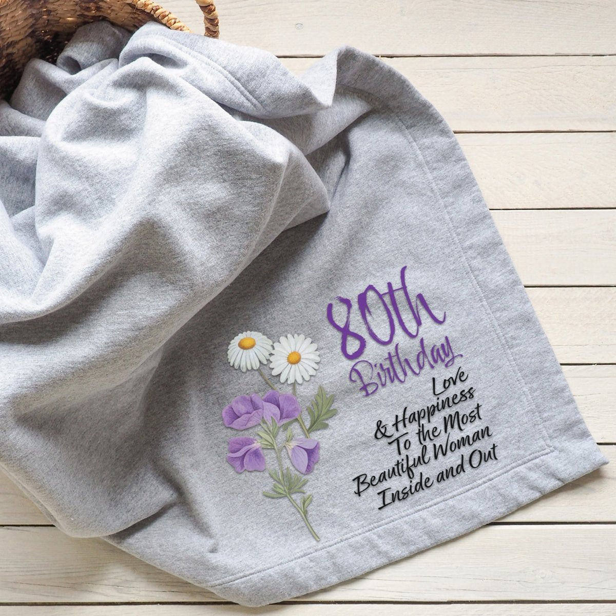 Gray blanket featuring delicate birth flower and a heartfelt birthday message.