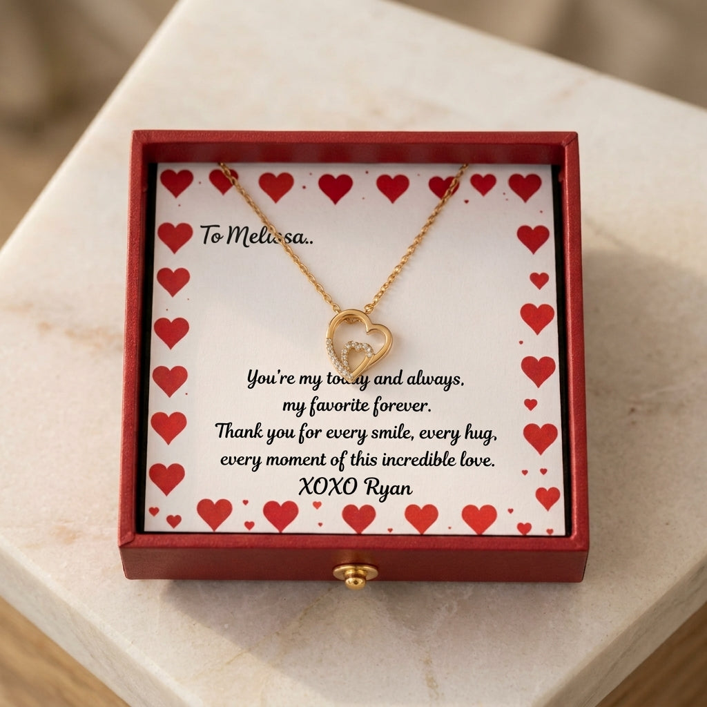 Gold double-heart necklace in red heart-patterned gift box with sample personalization text and recipient name.