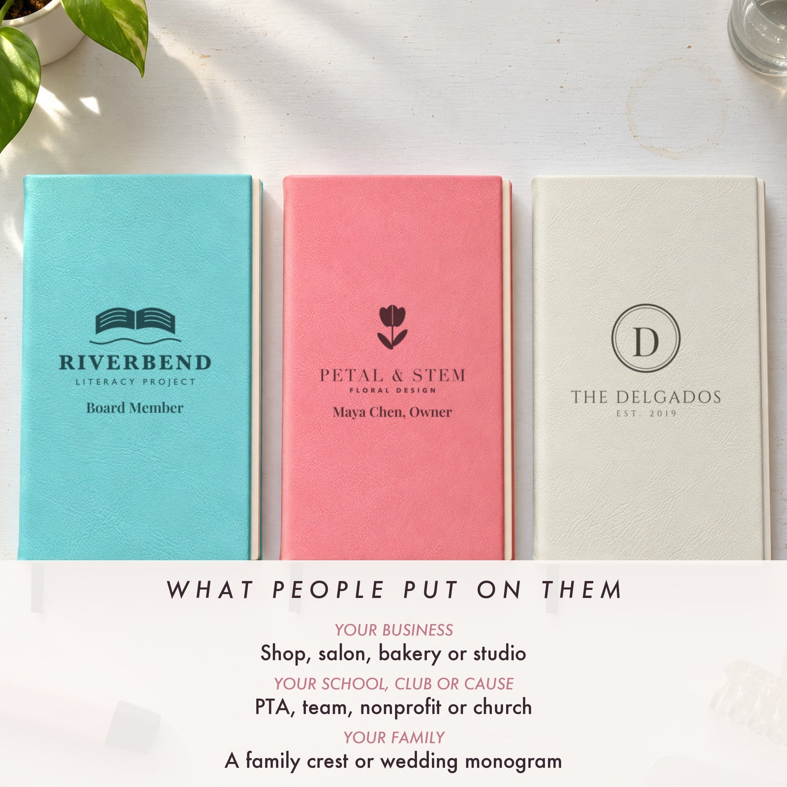 Teal, pink and white engraved journals with a nonprofit logo, a florist logo and a family monogram, showing logo ideas for a business, club or family