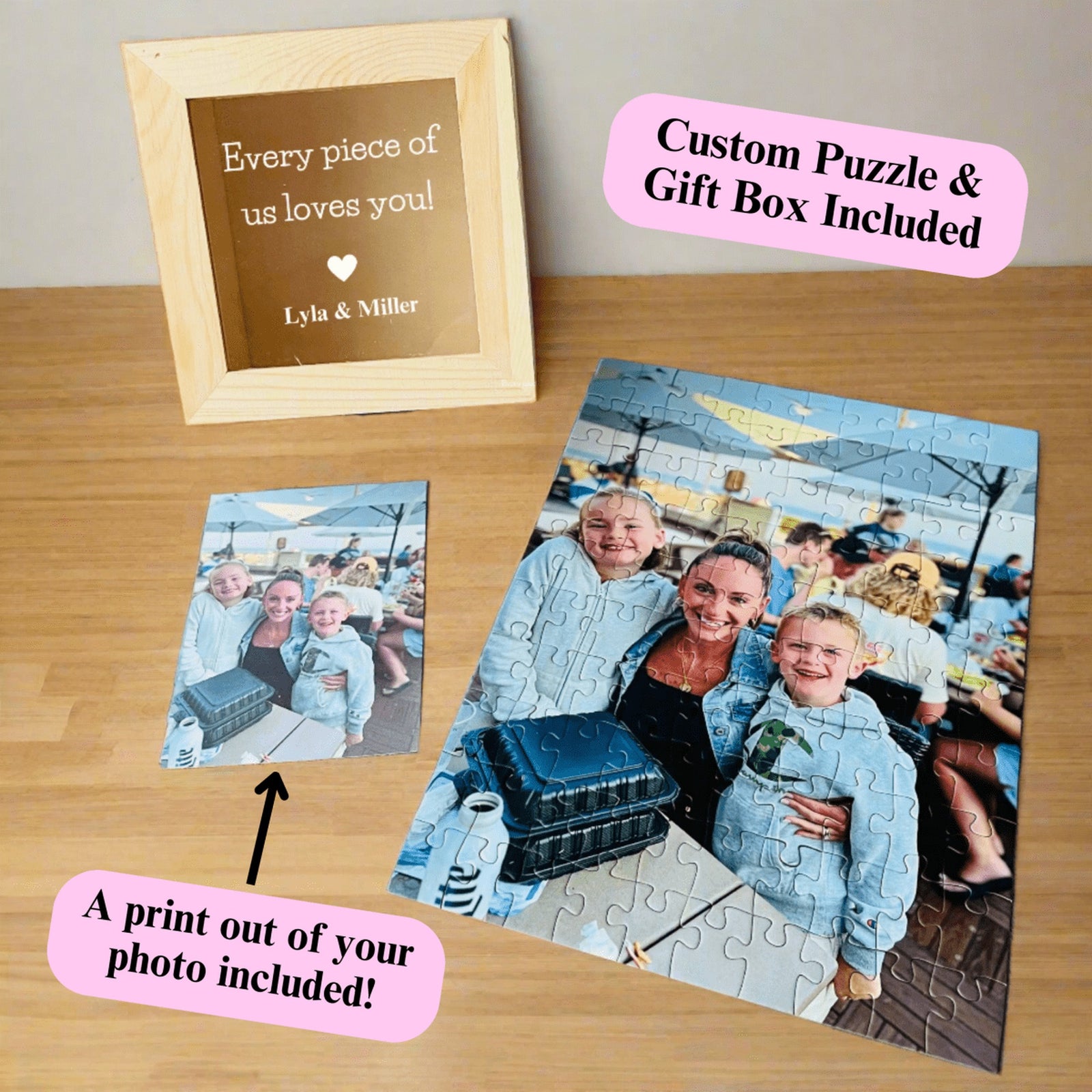 Personalized photo puzzle gift box in natural wood with a laser-engraved message on the lid, shown with an assembled 100-piece custom family photo puzzle