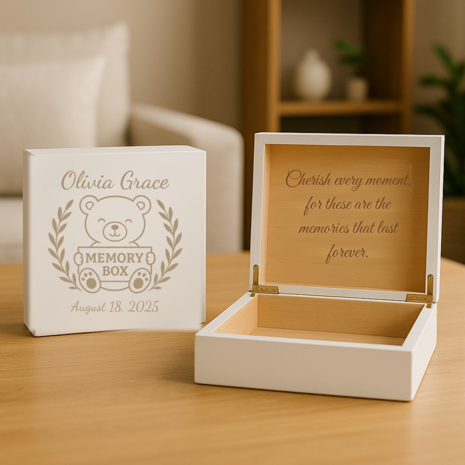 White personalized baby keepsake box engraved in tan with a teddy bear, laurel wreath, the sample name Olivia Grace and a birth date, beside the open box and its inside message