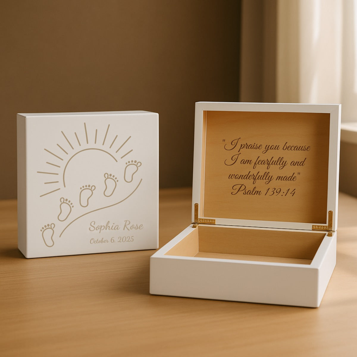 White personalized newborn keepsake box engraved with baby footprints under a rising sun and the sample name Sophia Rose, open beside a verse inside the lid