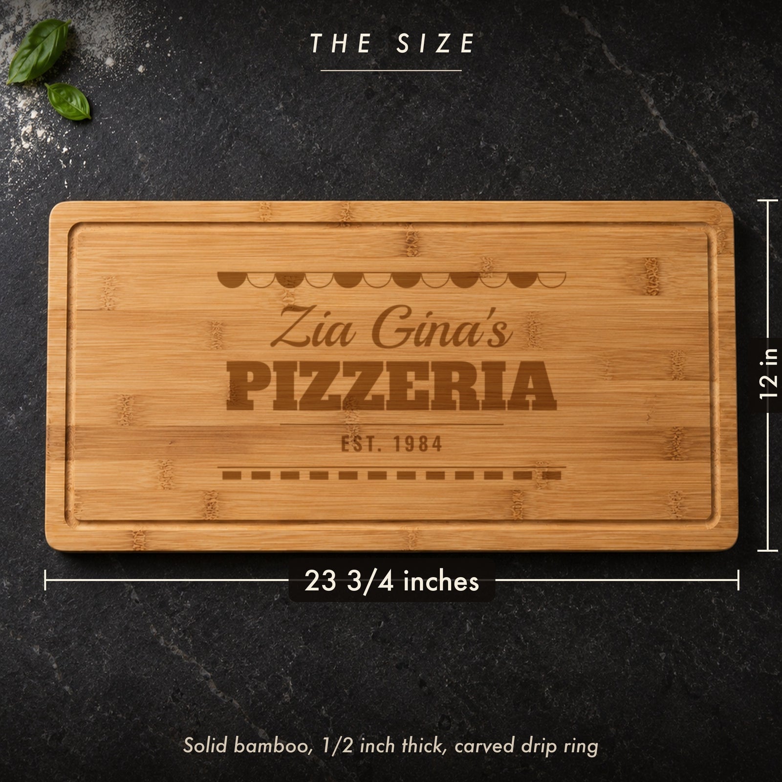 Size of the personalized pizza board, 23 3/4 inches long by 12 inches wide in half inch solid bamboo, engraved Zia Gina's PIZZERIA EST. 1984