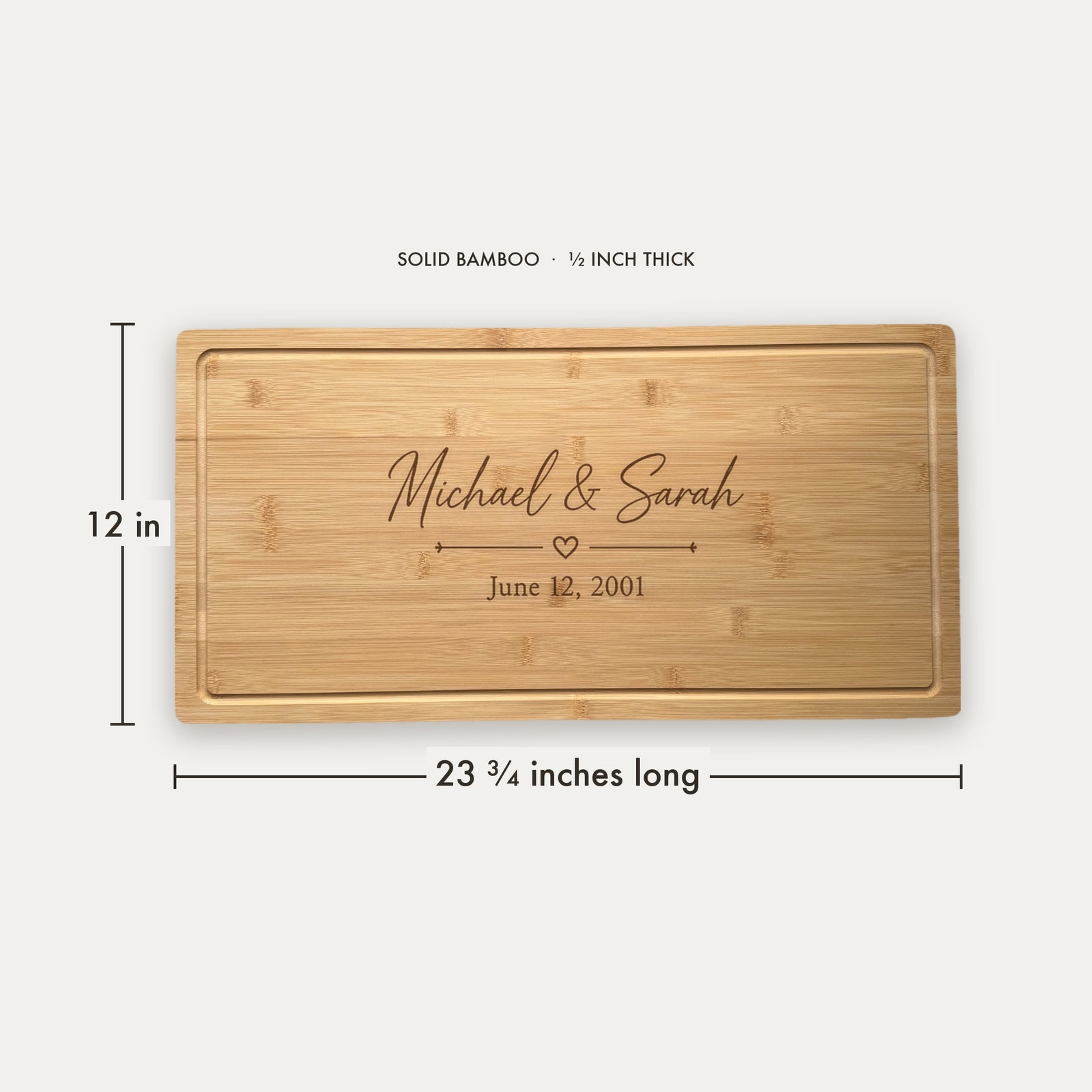 Size guide for the personalized wedding charcuterie board, 23 and three quarter inches long by 12 inches wide in half inch thick solid bamboo.