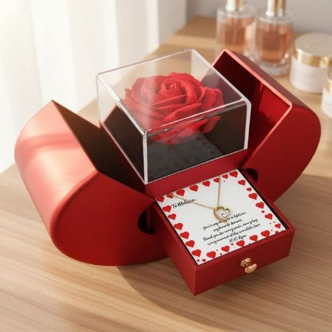 Personalized Valentine’s Day gifts for a girlfriend arranged together, including an engraved keepsake box, a photo light box and a custom necklace