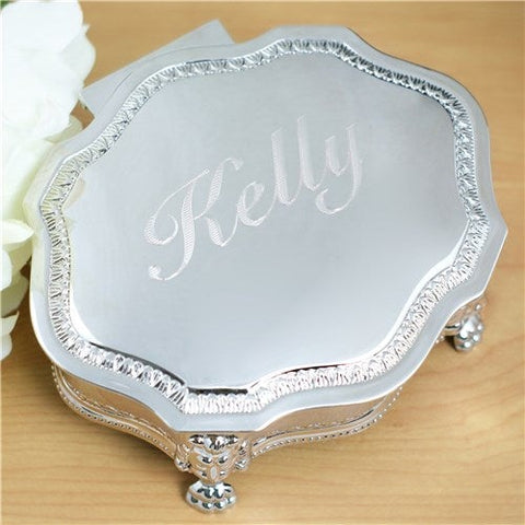 Classic personalized wooden jewelry box with an engraved lid and dark blue flocked cloth lining, one of the collection sizes covered in this buying guide
