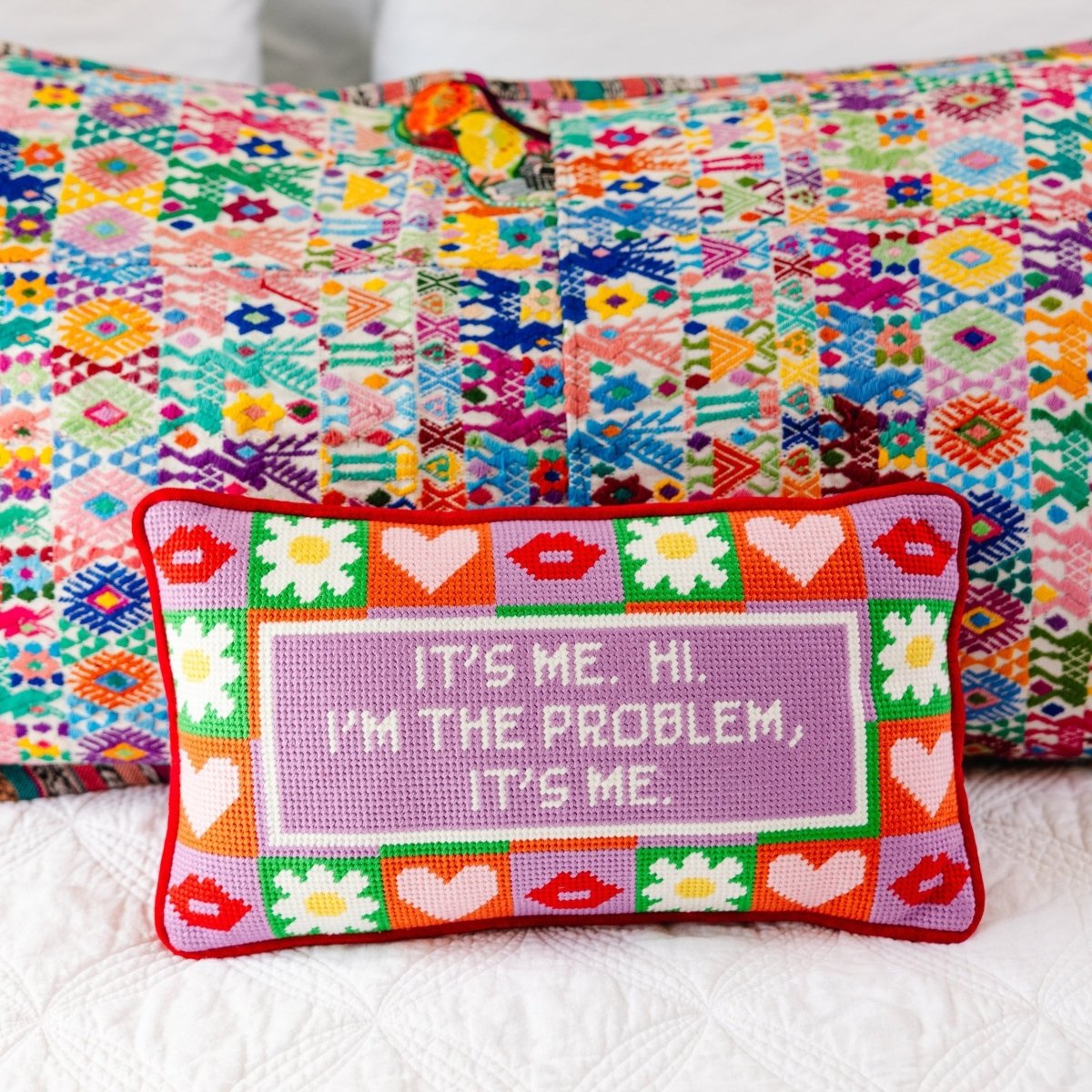 It’s Me needlepoint pillow with cheeky wool embroidery and a luxurious cotton velvet back, measuring 8x14 inches, ideal for fun and stylish decor.