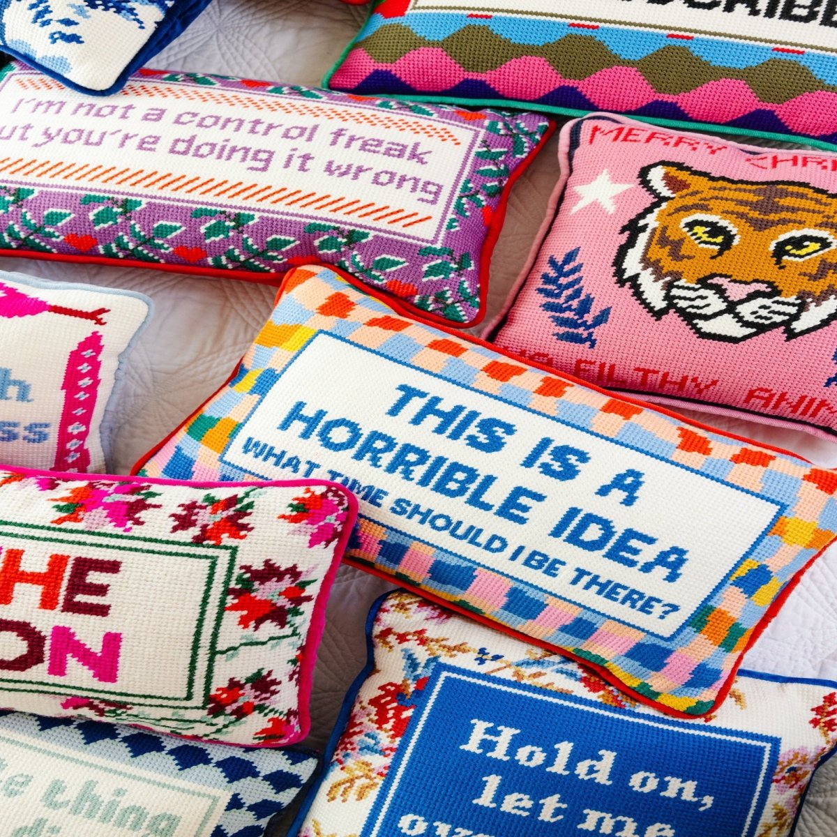 Horrible Idea needlepoint pillow with bold 100% wool embroidery and cotton velvet backing, measuring 9x15 inches, for a playful touch to your decor.