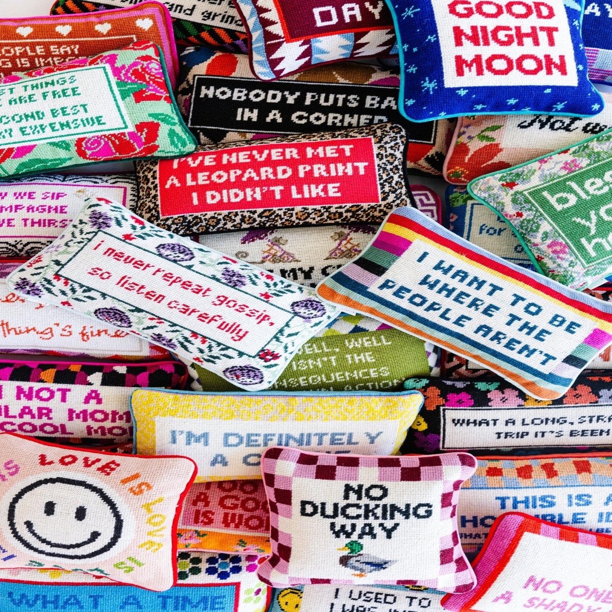 I Want to Be Where the People Aren’t needlepoint pillow, 8x14 inches, featuring wool embroidery and a cotton velvet back, a witty and cozy accent.