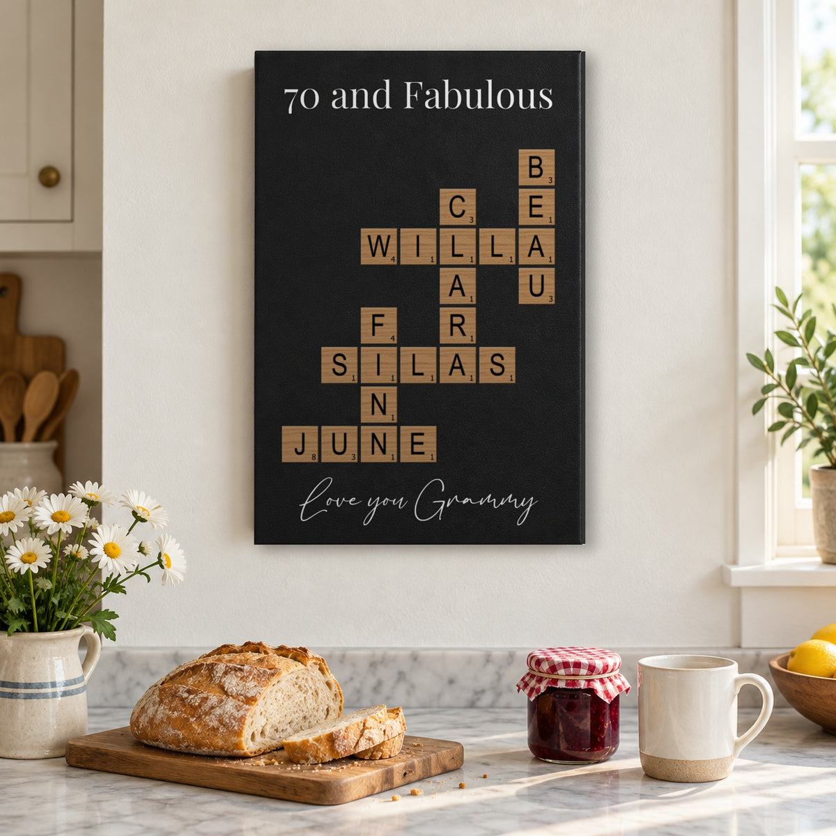 70th birthday gift for Grandma: a 70 and Fabulous crossword sign with the grandkids' names hanging in a bright farmhouse kitchen