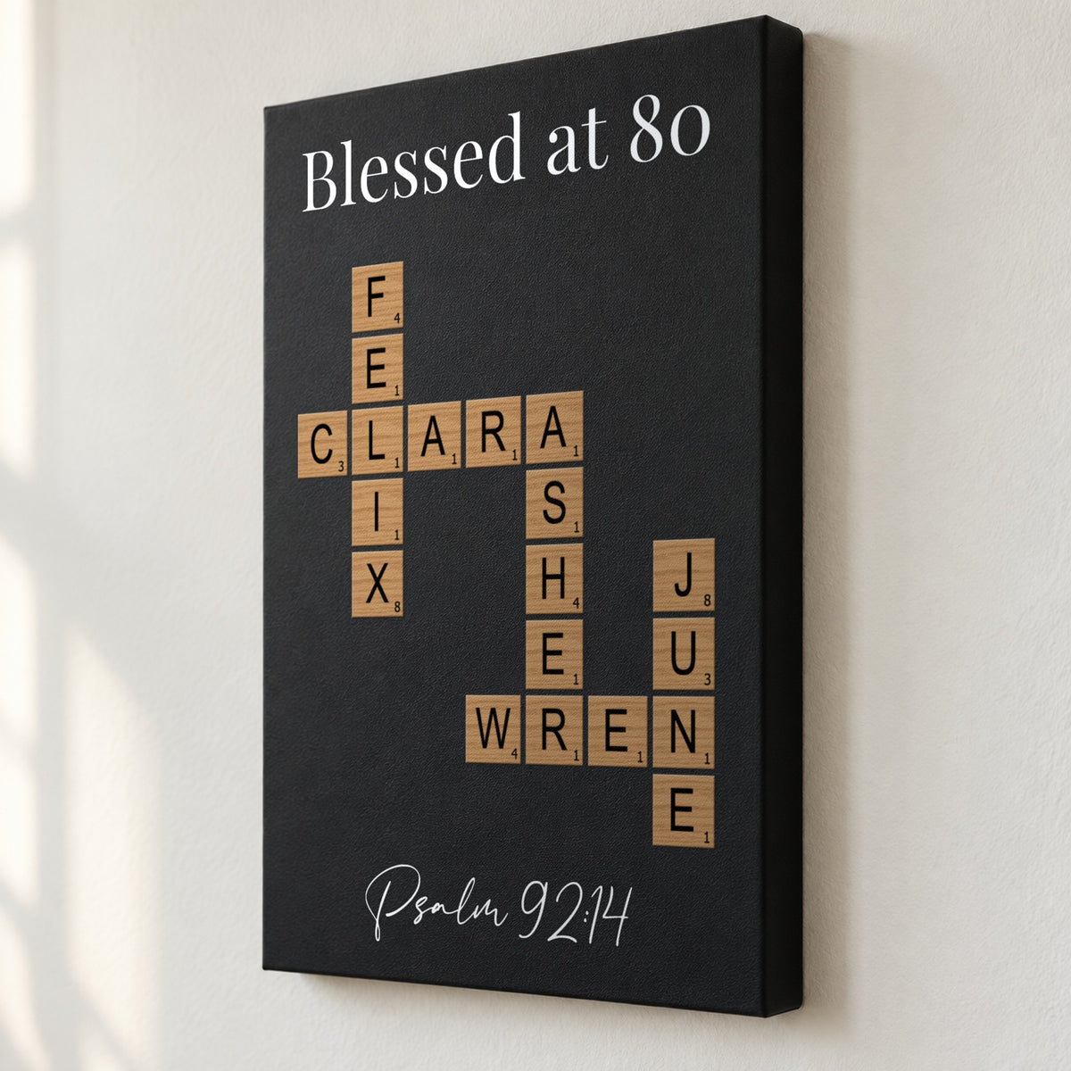 Angled close view of a Blessed at 80 crossword sign with Psalm 92:14, showing the 1.5 inch deep edge and family names printed flat