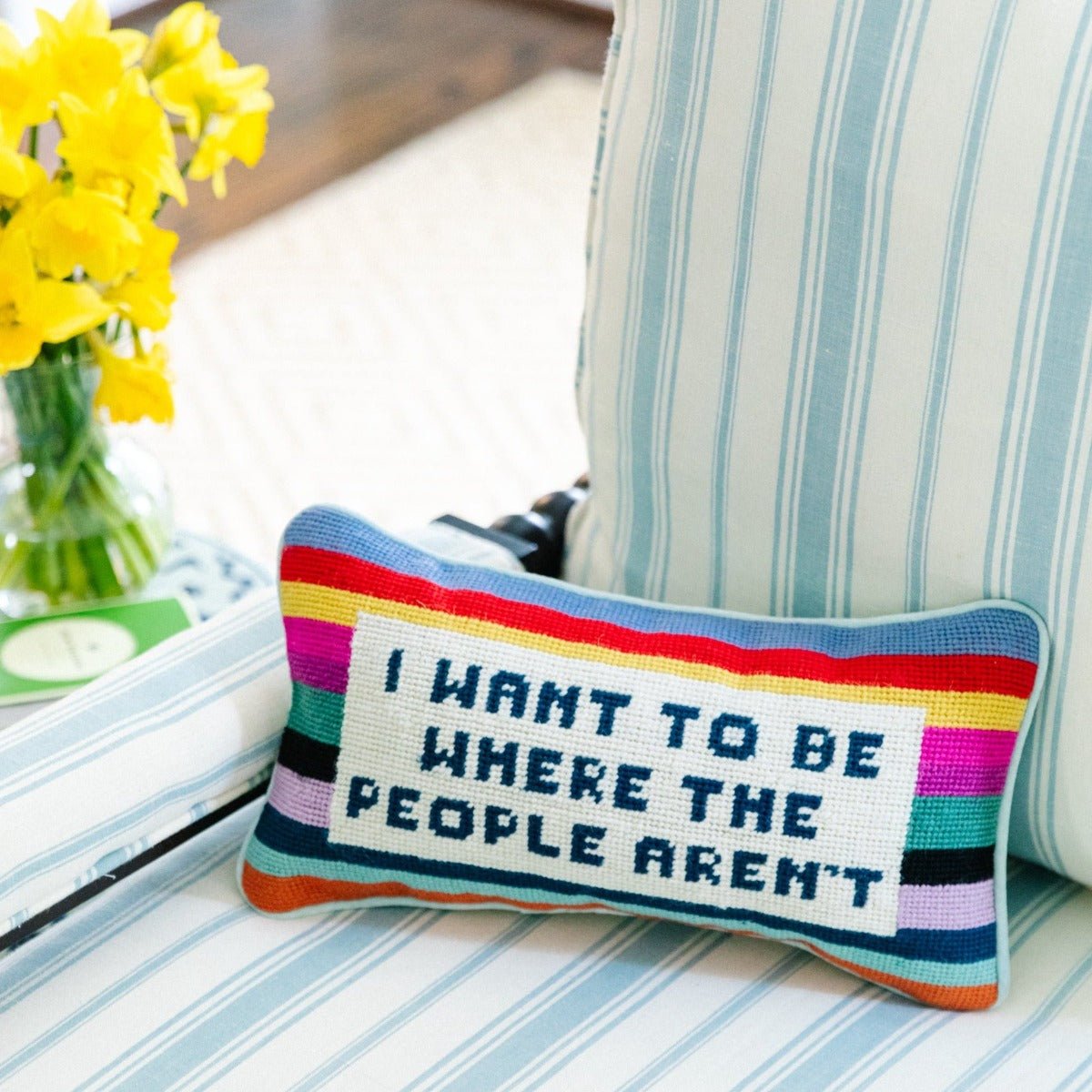 I Want to Be Where the People Aren’t needlepoint pillow, 8x14 inches, featuring wool embroidery and a cotton velvet back, a witty and cozy accent.