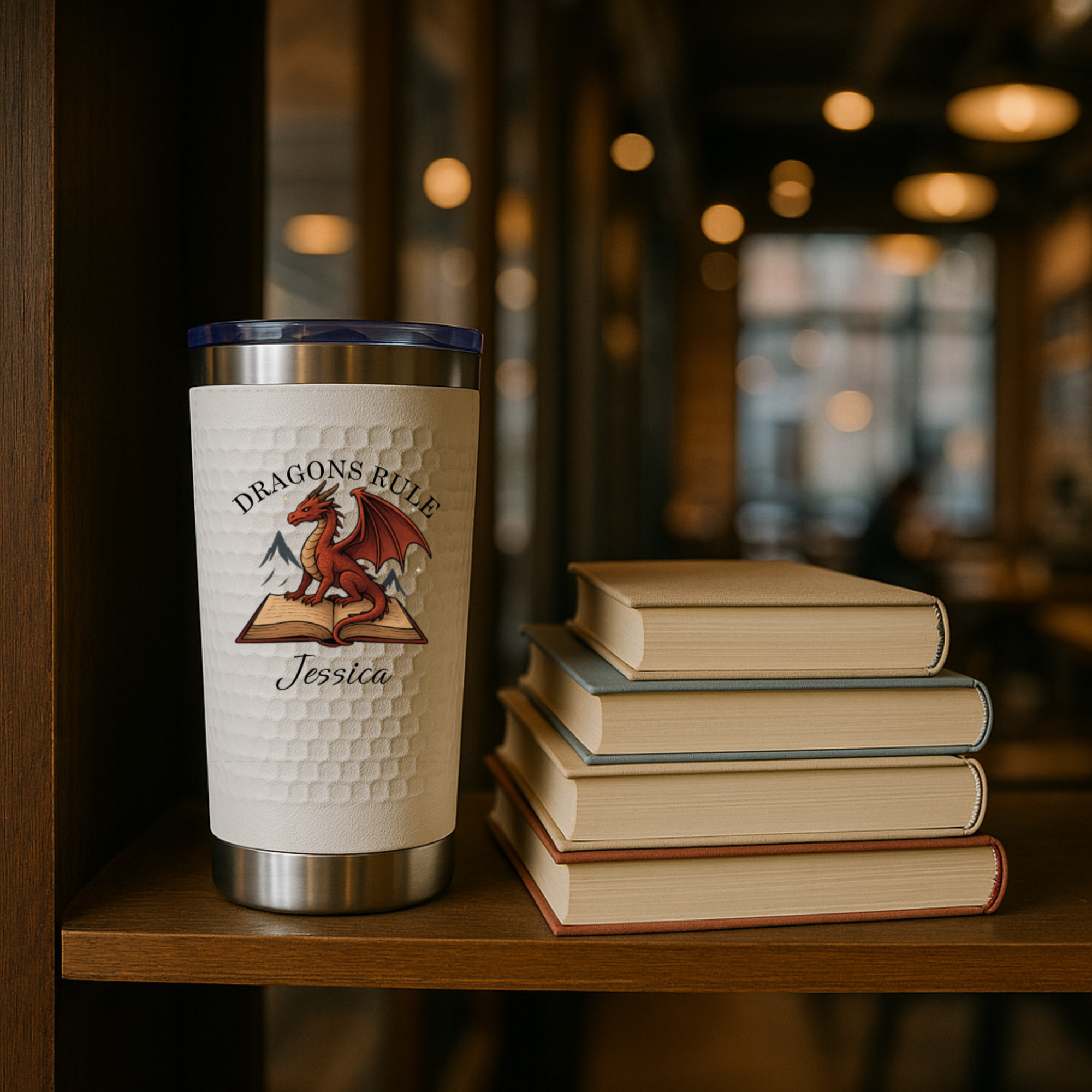 Custom book-themed tumbler with floral and fantasy designs personalized with name