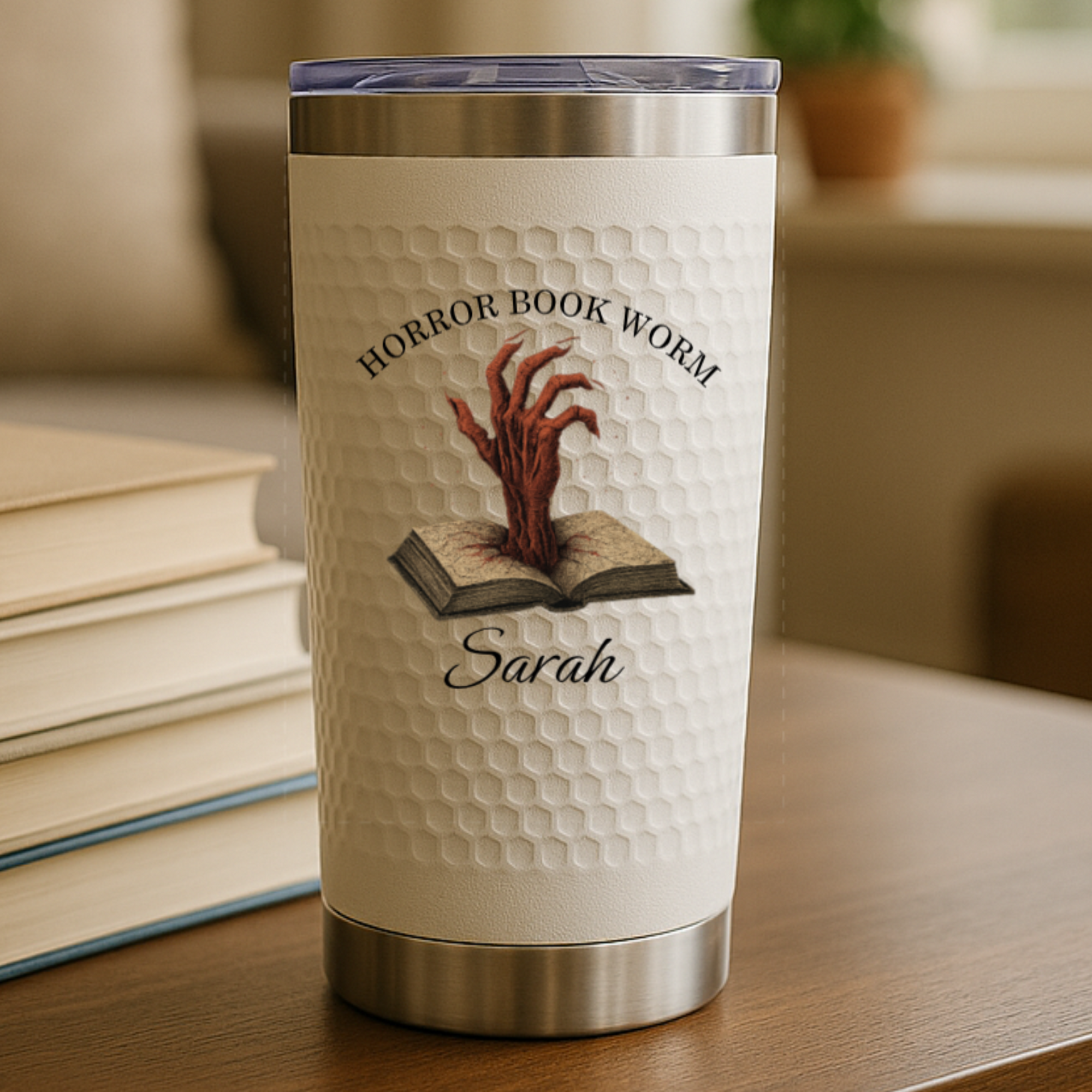 Custom book-themed tumbler with floral and fantasy designs personalized with name