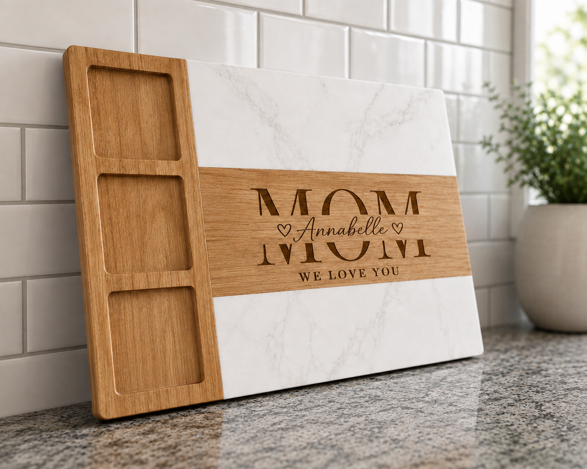 Wooden charcuterie board with marble and wood sections, engraved with "MOM", sample name "Annabelle" and "WE LOVE YOU" with hearts
