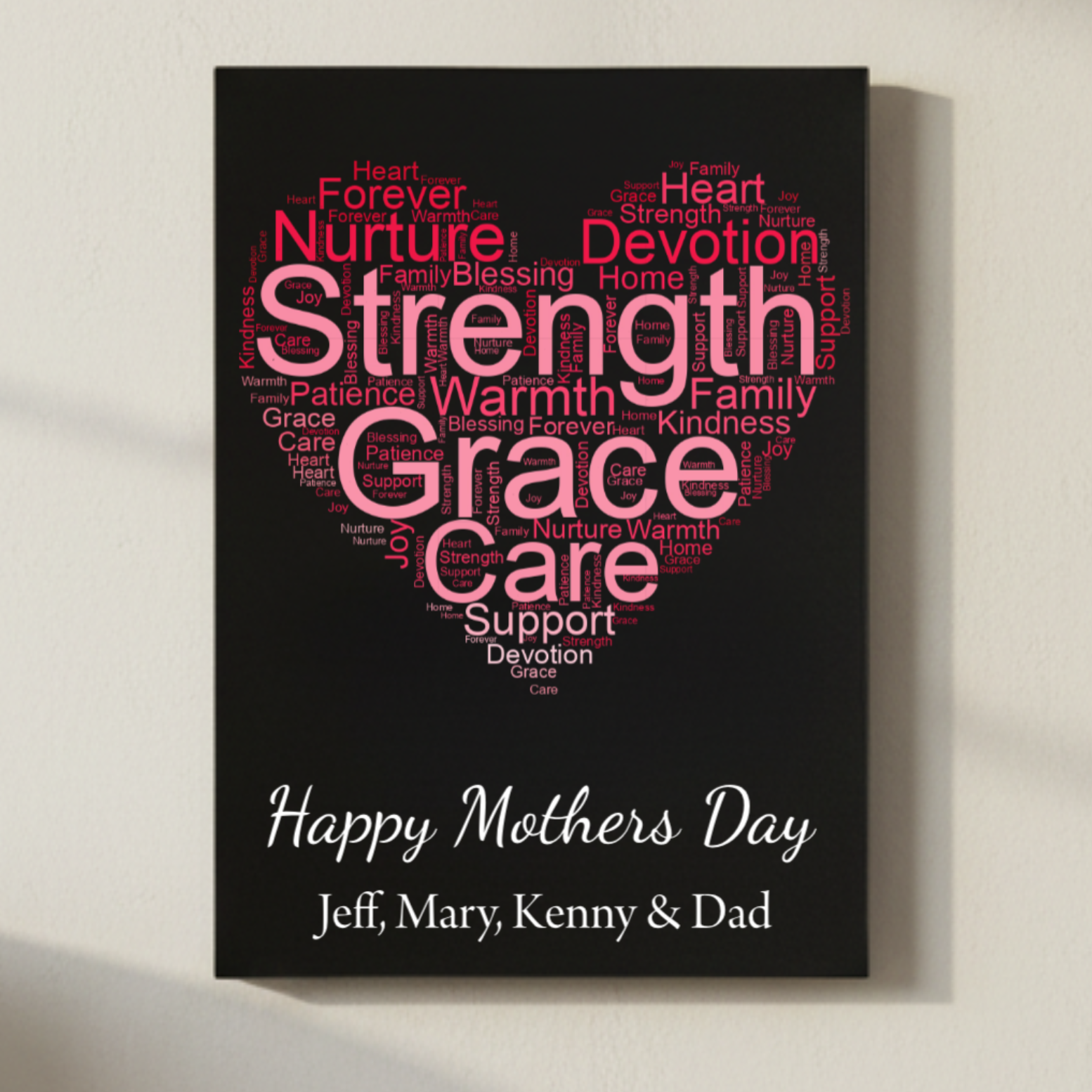 Black canvas with heart-shaped word cloud in pink and red tones featuring words like "Strength," "Grace," "Care," and "Nurture," personalized with sample names "Jeff, Mary, Kenny & Dad" and "Happy Mothers Day" text below