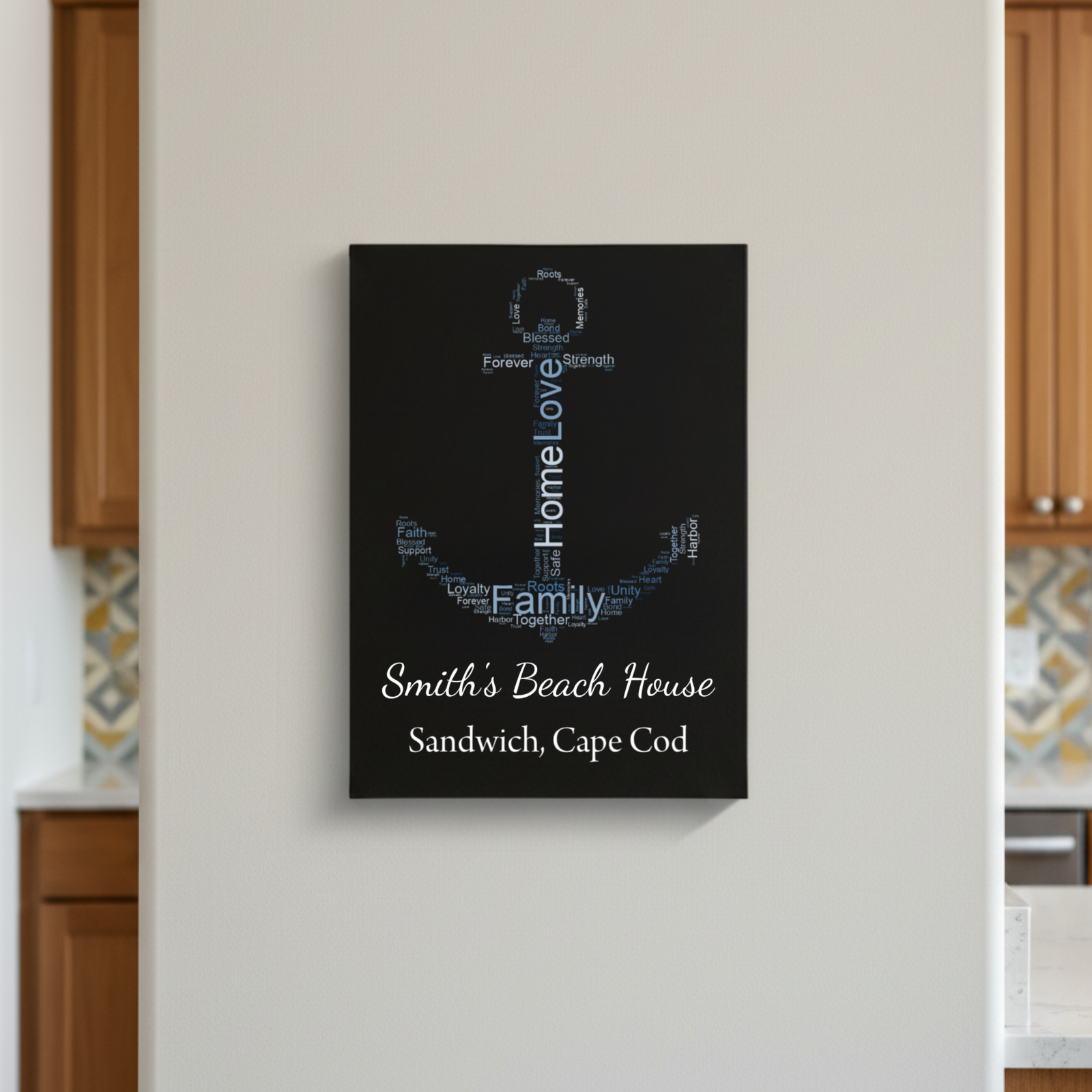 Black canvas wall sign with "Home Love Family" word art in anchor shape, personalized with sample text "Smith's Beach House" and "Sandwich, Cape Cod" in white script at bottom