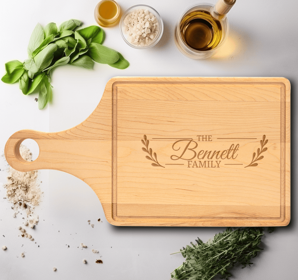 Family Name Maple Paddle Cutting Board With Flourishing Family Design