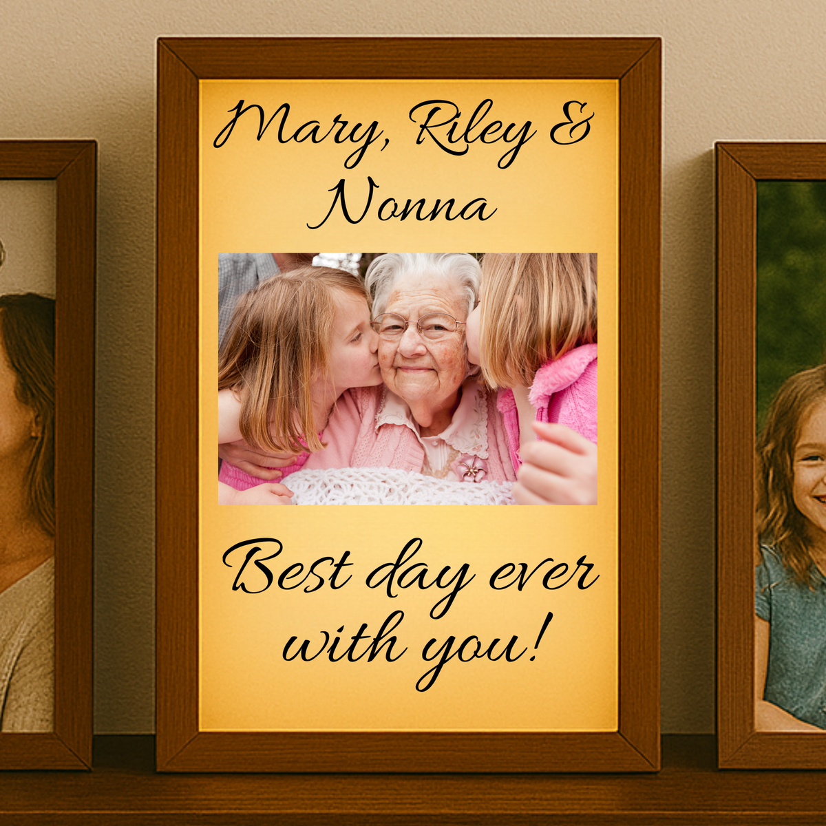 Framed photo of grandkids kissing an grand mother with text &#39;Mary, Riley &amp; Nonna Best day ever with you!&#39; on a shelf.
