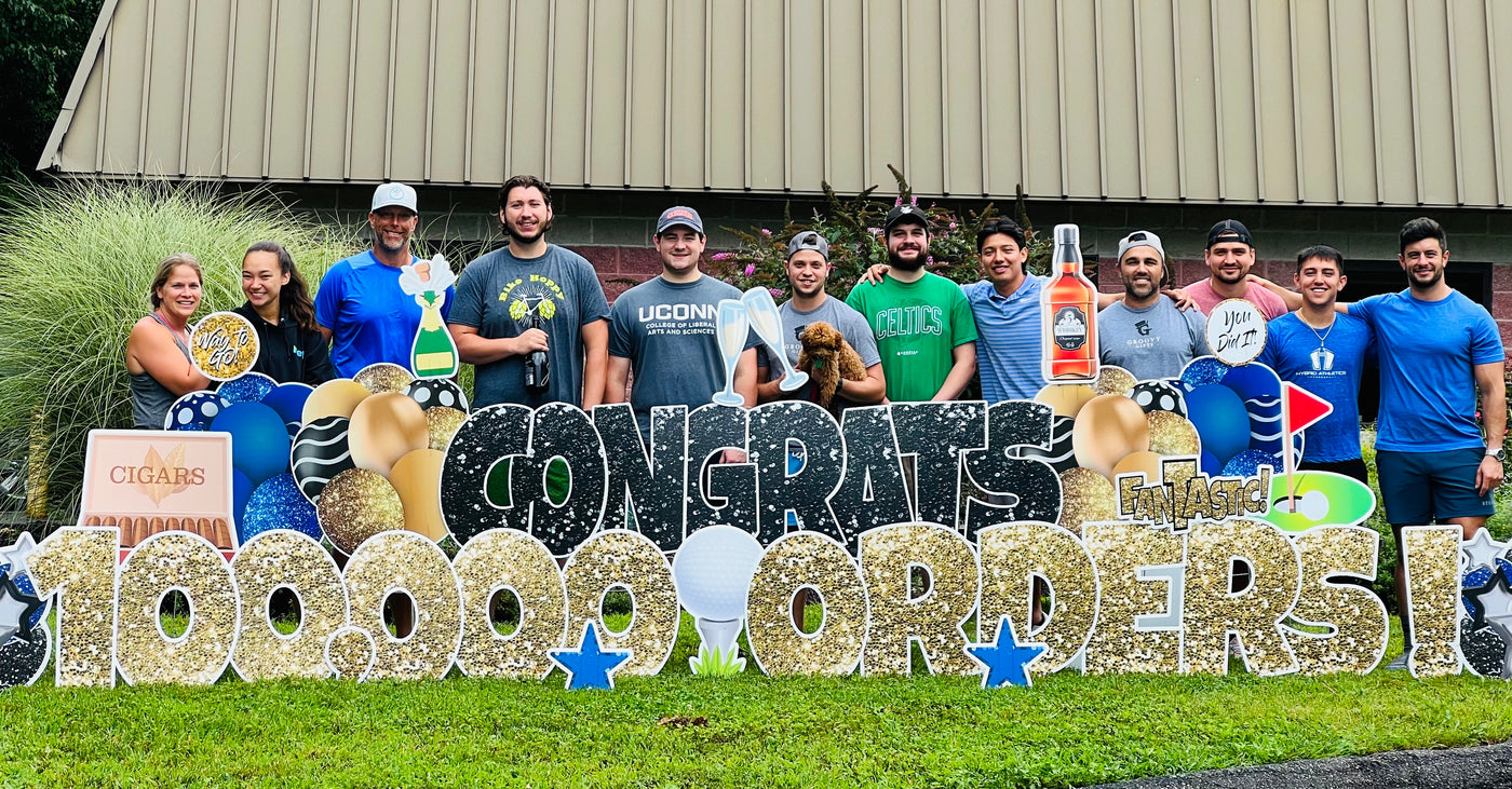 The Groovy team celebrating 100,000 orders outside the Monroe, Connecticut workshop