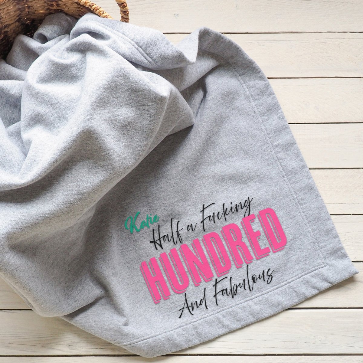 Gray blanket with a bold and sassy &quot;Half a F***ing Hundred and Fabulous&quot; design.