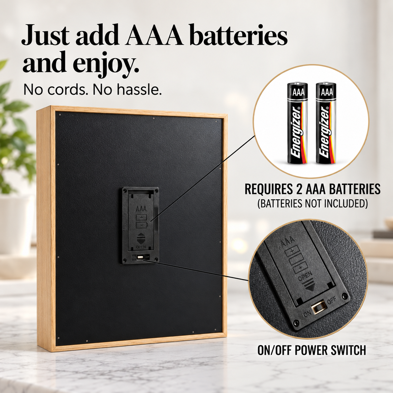 Battery-powered light box back panel with wooden frame, showing battery compartment requiring two AAA batteries and on-off power switch