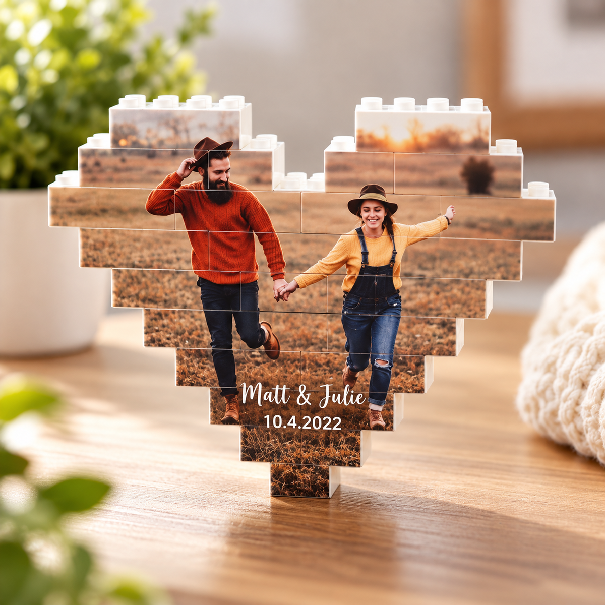 Heart-shaped personalized photo brick keepsake of a couple walking through a field, with their names "Matt &amp; Julie" and the date 10.4.2022 printed below the photo.