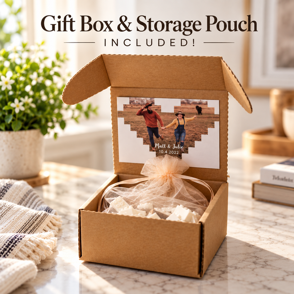 Open kraft gift box with a heart-shaped photo brick keepsake lid card reading "Matt &amp; Julie, 10.4.2022," the disassembled bricks wrapped in an organza pouch inside.