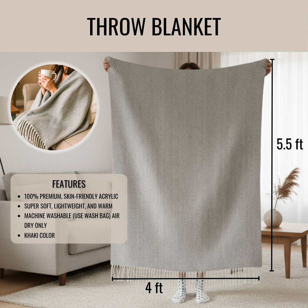 Grey herringbone throw blanket with cream tassels displayed at 4 feet wide by 5.5 feet tall, shown held up in a living room setting with size reference.