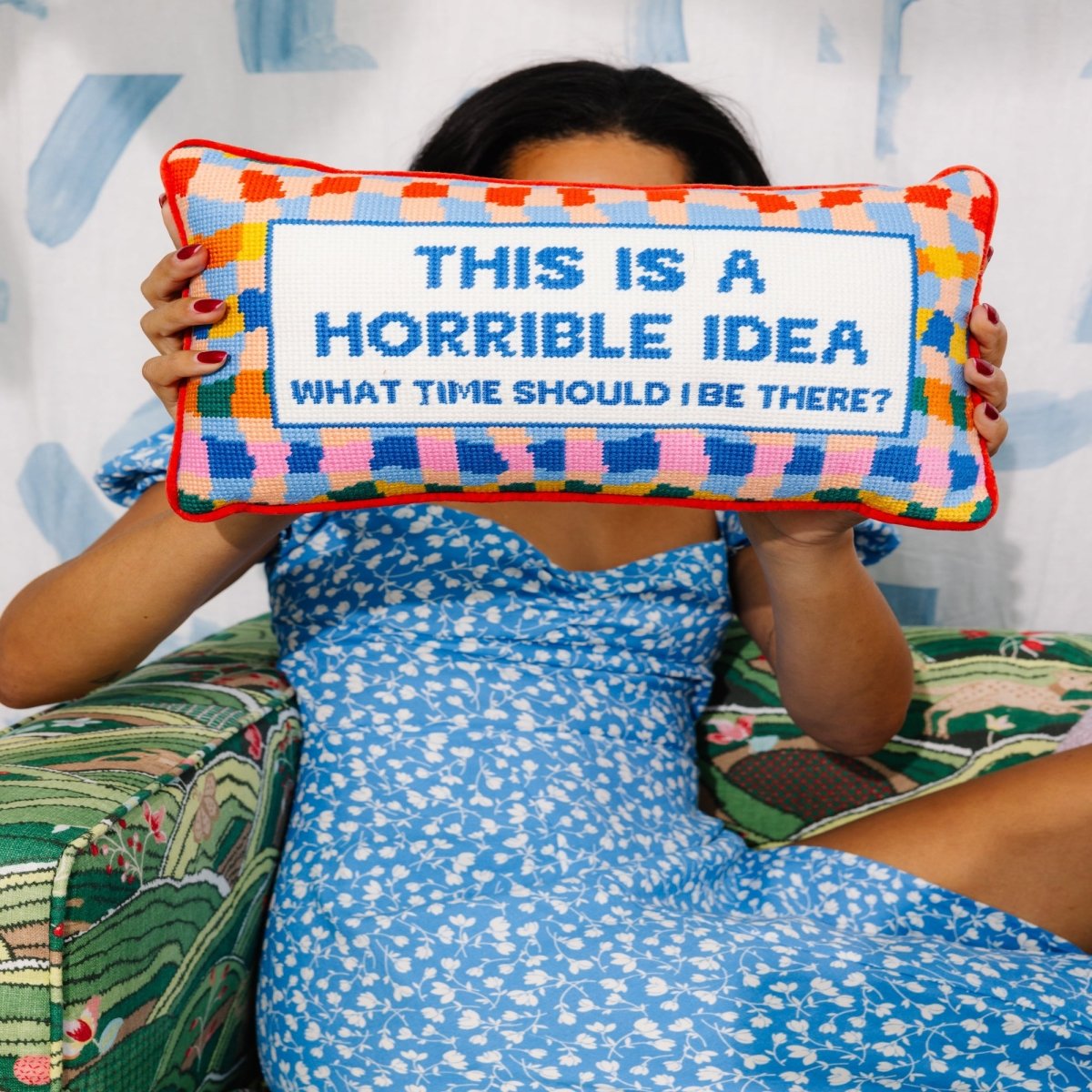 Horrible Idea needlepoint pillow with bold 100% wool embroidery and cotton velvet backing, measuring 9x15 inches, for a playful touch to your decor.