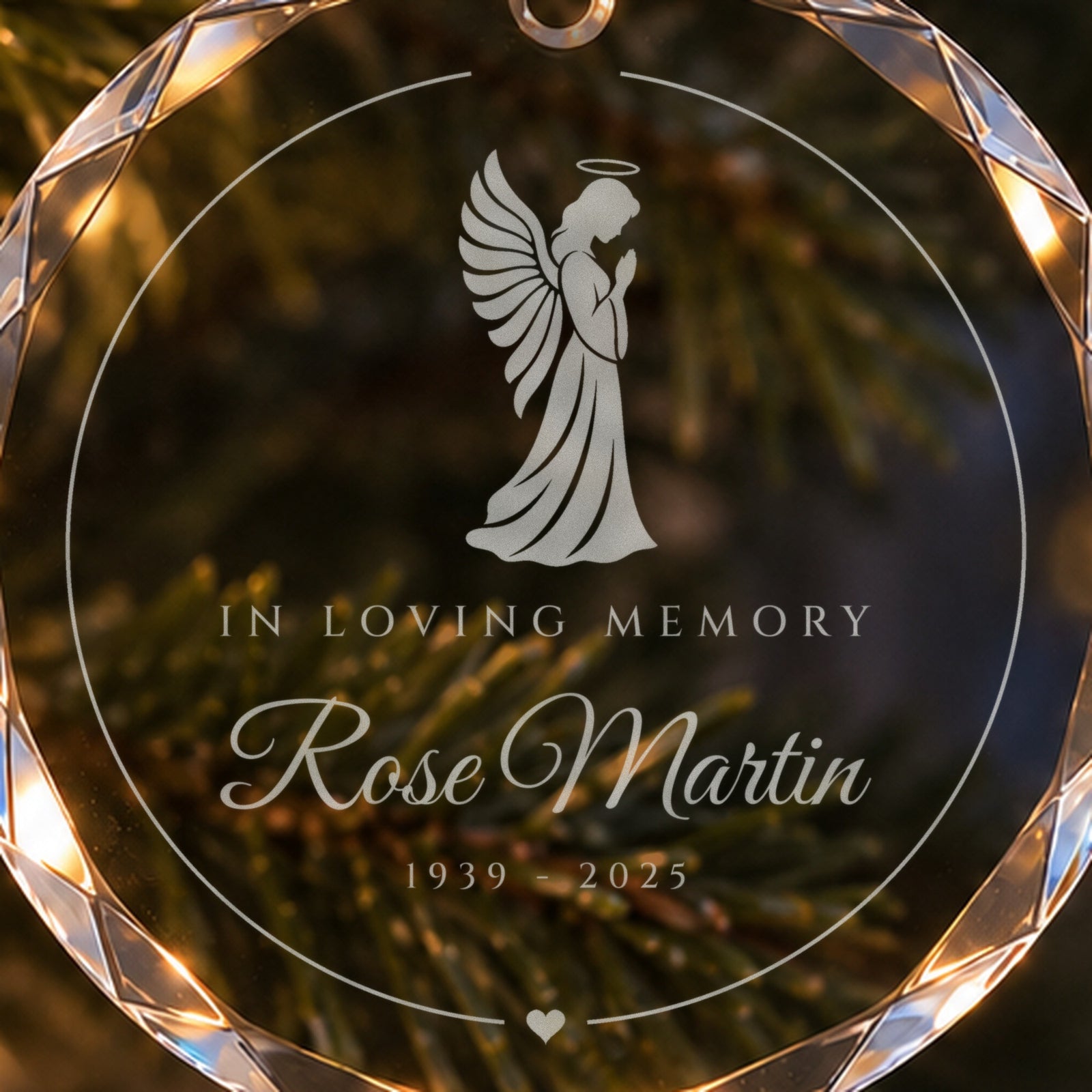 Close-up of the frosted praying angel engraving on the memorial Christmas ornament, with In Loving Memory, Rose Martin and her years