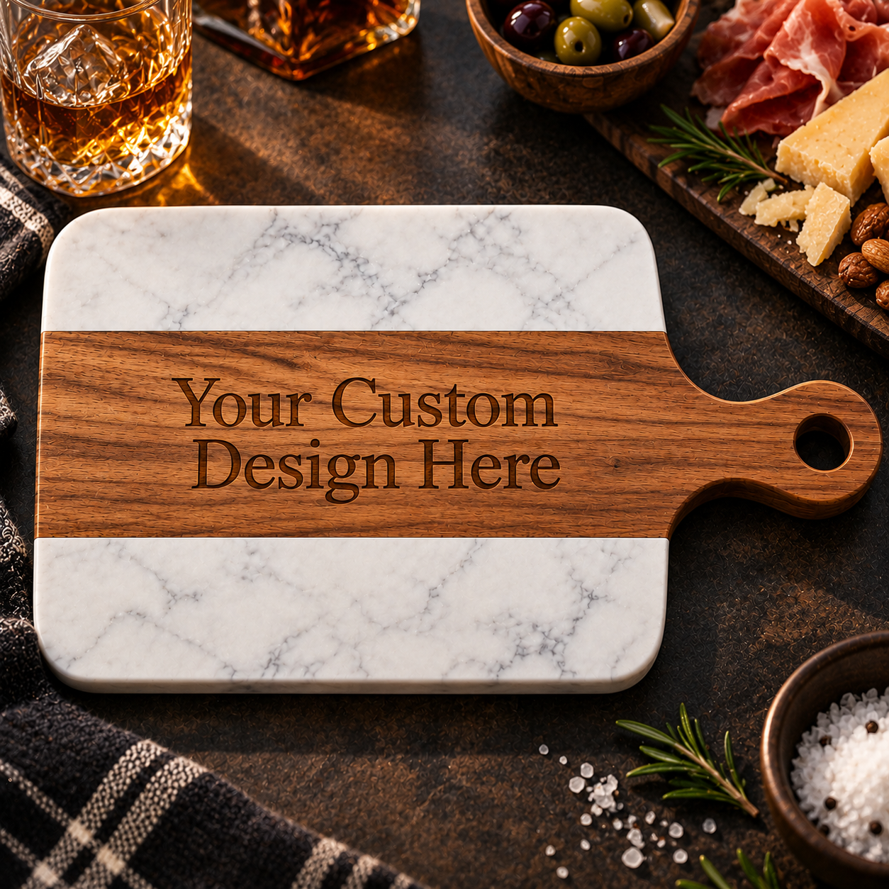 Marble and acacia wood charcuterie board with a paddle handle, personalized with custom engraved text across the wood center band.