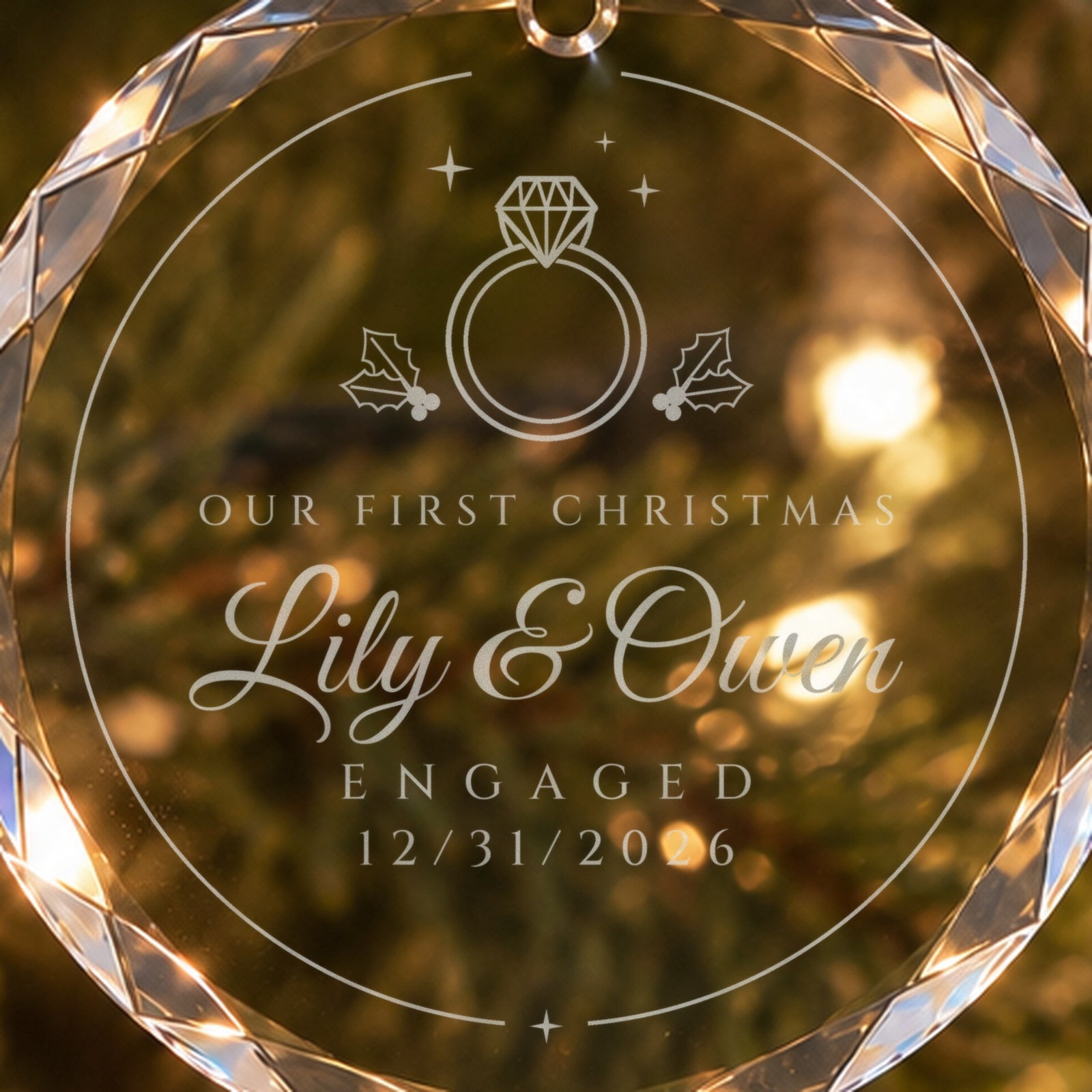 Close-up of the frosted engraving on the engagement Christmas ornament: diamond ring with holly, OUR FIRST CHRISTMAS, Lily & Owen, ENGAGED