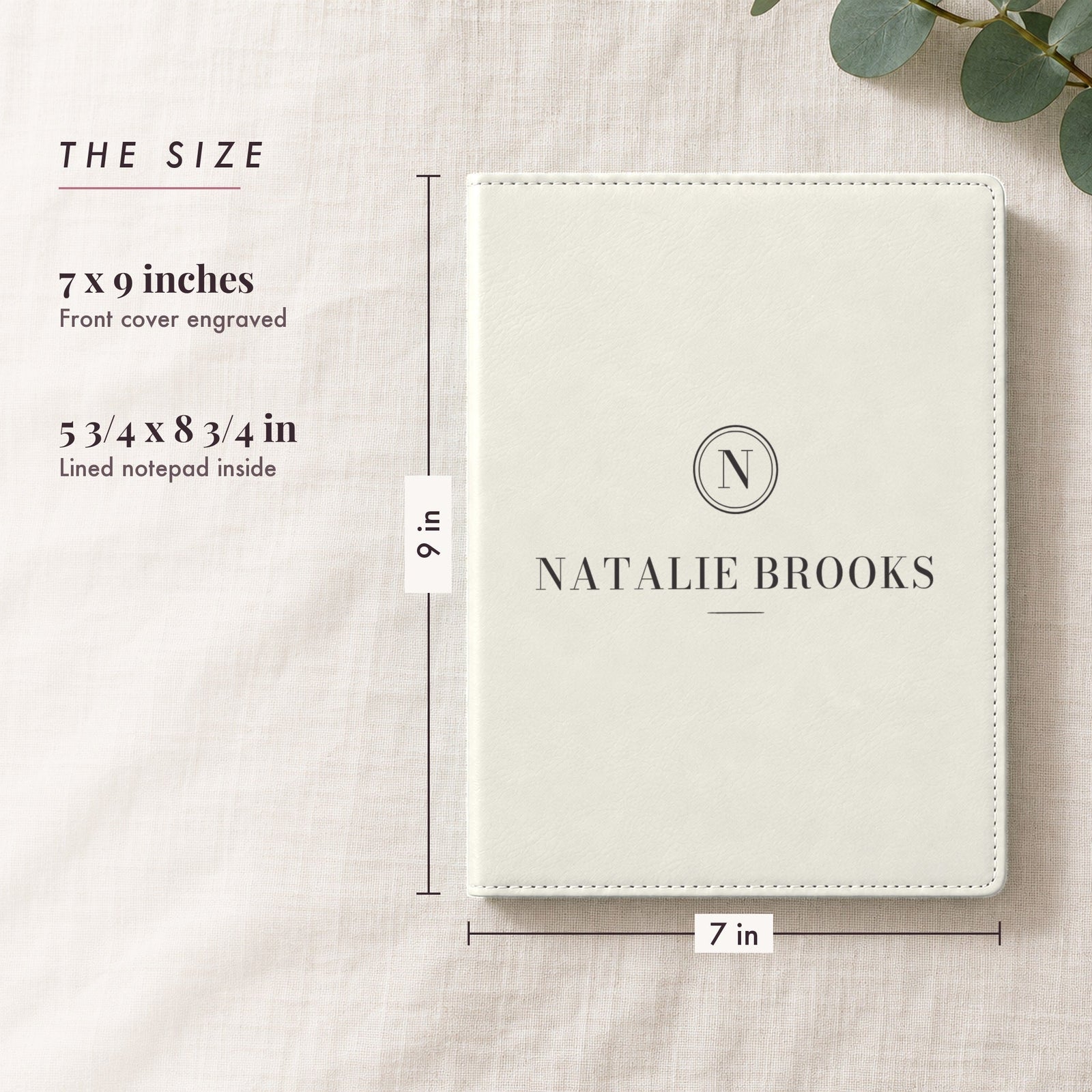Size of the engraved padfolio, 7 by 9 inches with a 5 3/4 by 8 3/4 inch lined notepad, shown in white with just an N seal and the name Natalie Brooks