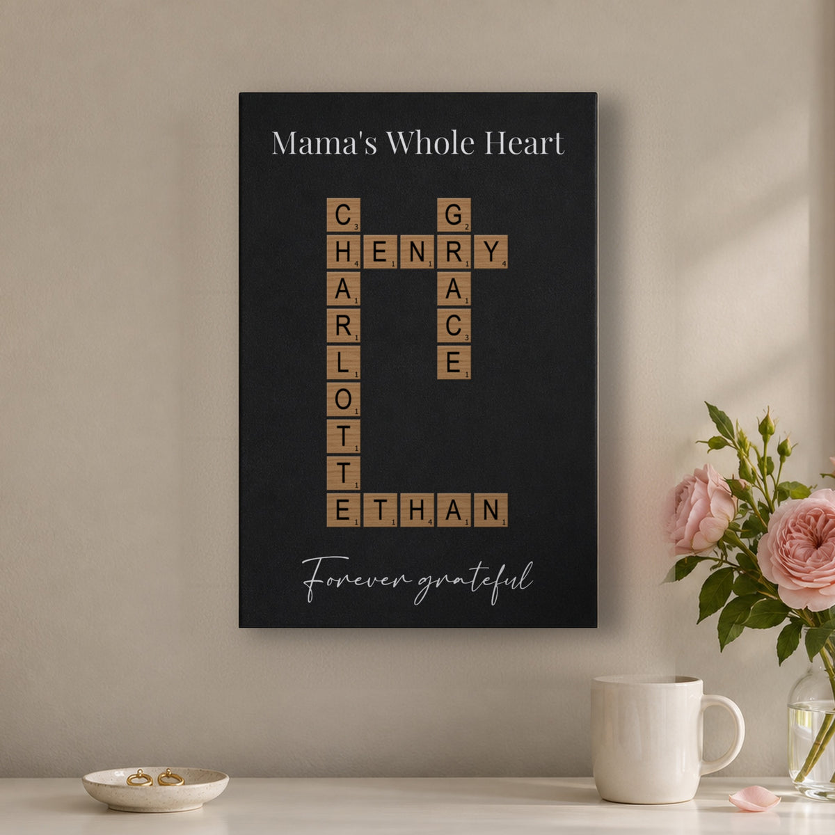 Gift for Mom from her kids: a Mama's Whole Heart crossword sign with Forever grateful, hanging above a white dresser with pink garden roses