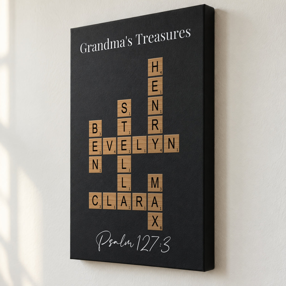 Angled close view of a Grandma's Treasures crossword sign showing the 1.5 inch deep edge and grandkids' names printed flat on black leatherette